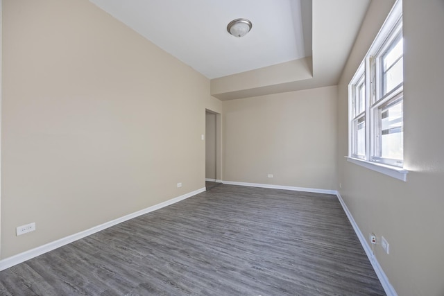 empty room featuring dark hardwood / wood-style flooring