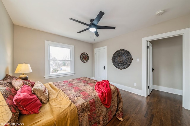 bedroom with ceiling fan and dark hardwood / wood-style flooring