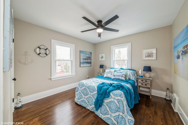 bedroom featuring ceiling fan and dark hardwood / wood-style flooring