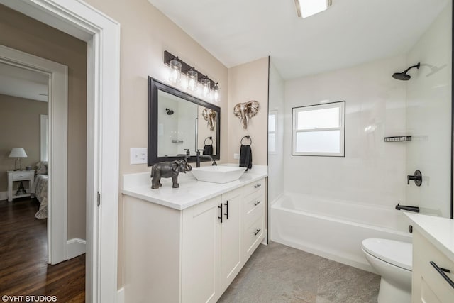 full bathroom featuring vanity, shower / washtub combination, and toilet