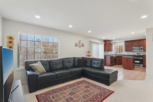 living room featuring light carpet