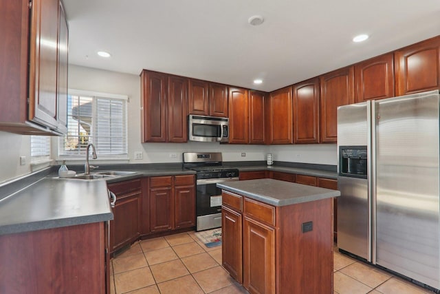 kitchen featuring stainless steel appliances, light tile patterned flooring, a kitchen island, and sink