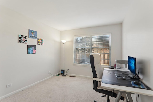 office area featuring light colored carpet