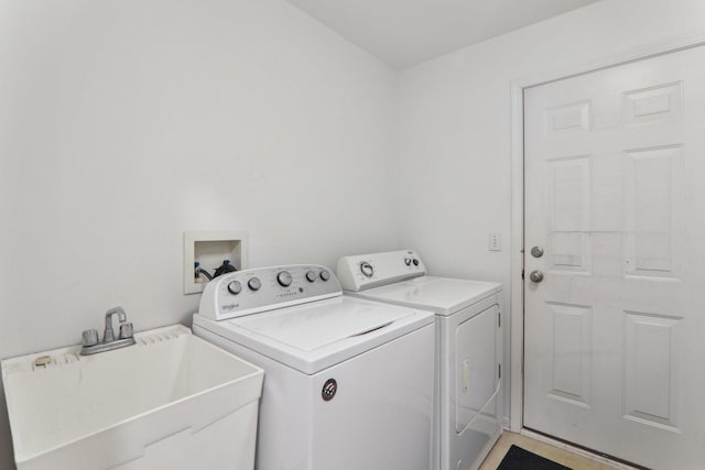 laundry room with sink and washer and dryer