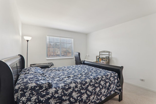 bedroom featuring light carpet