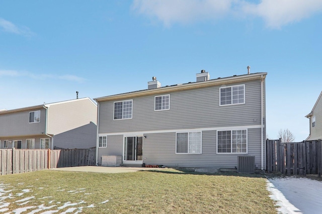 rear view of property with a yard and a patio