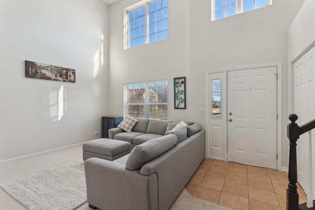 tiled living room with a towering ceiling