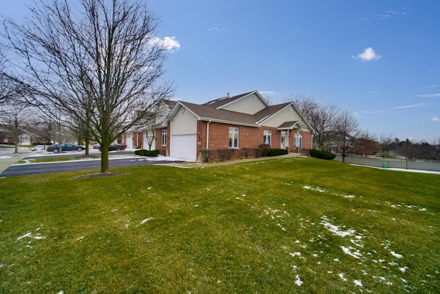 view of front of property featuring a garage and a front yard