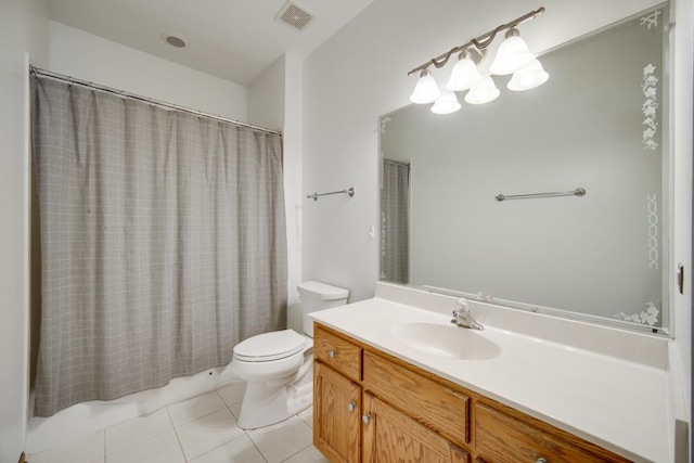 full bathroom with vanity, toilet, tile patterned flooring, and shower / bath combo with shower curtain