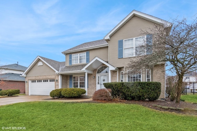 view of front property with a garage and a front lawn