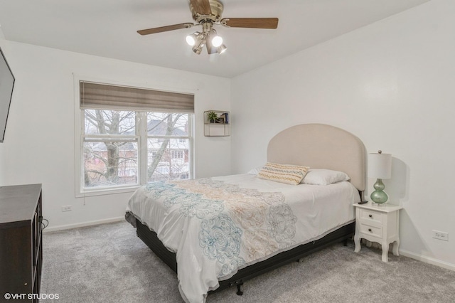 bedroom with ceiling fan and light colored carpet