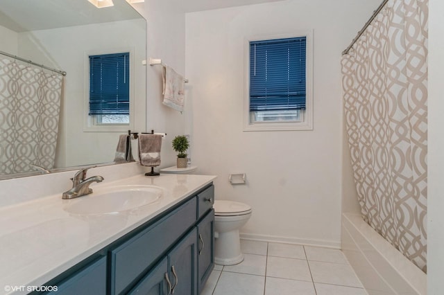 bathroom with tile patterned flooring, vanity, and toilet