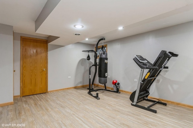 exercise area featuring light hardwood / wood-style floors