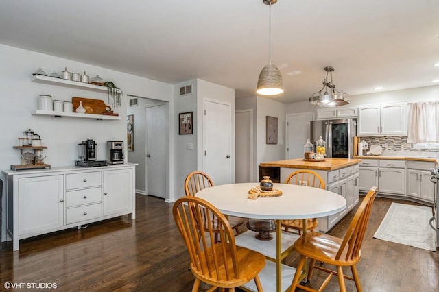 dining area with dark wood-type flooring