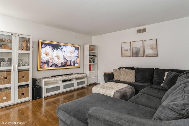 living room featuring dark hardwood / wood-style flooring