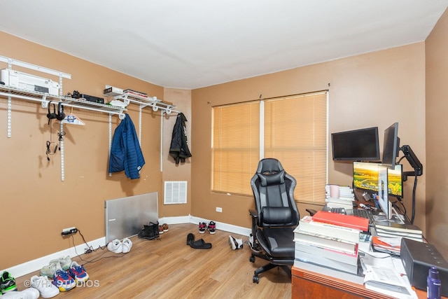 office space with hardwood / wood-style floors