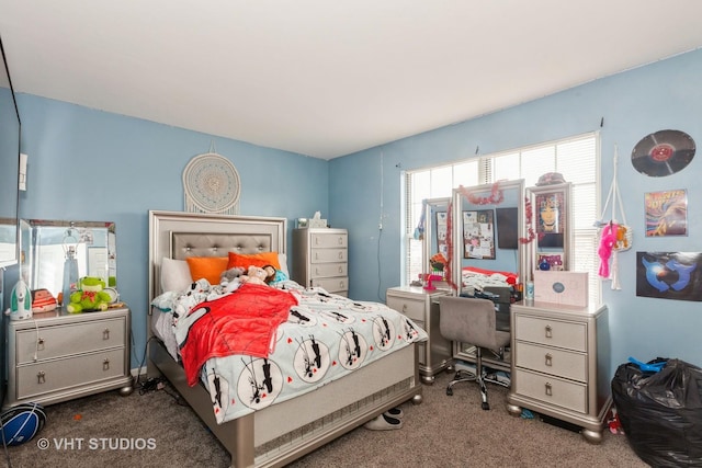 bedroom featuring dark colored carpet