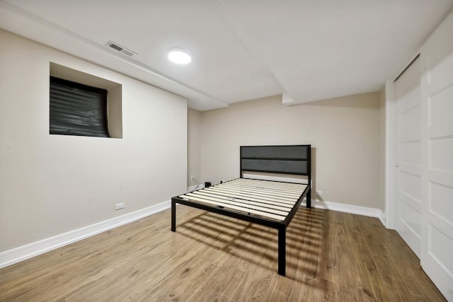 bedroom featuring wood-type flooring