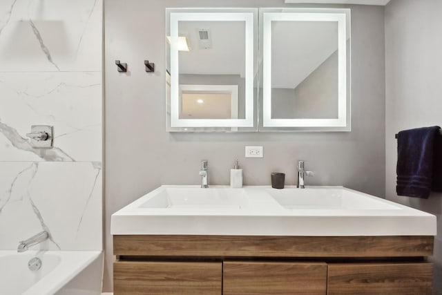 bathroom featuring vanity and tub / shower combination