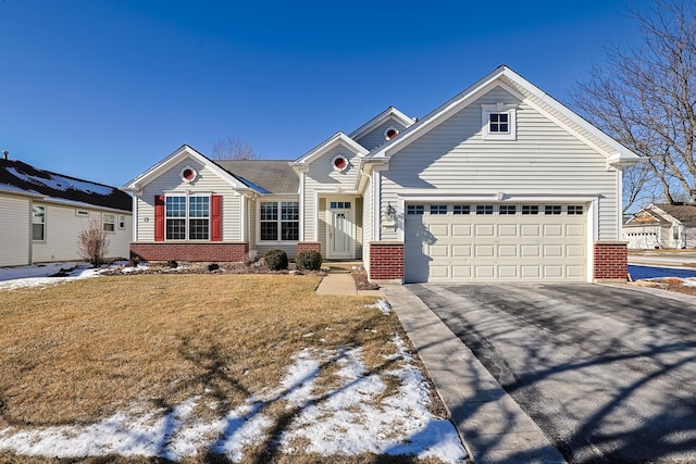 view of front facade featuring a garage and a yard