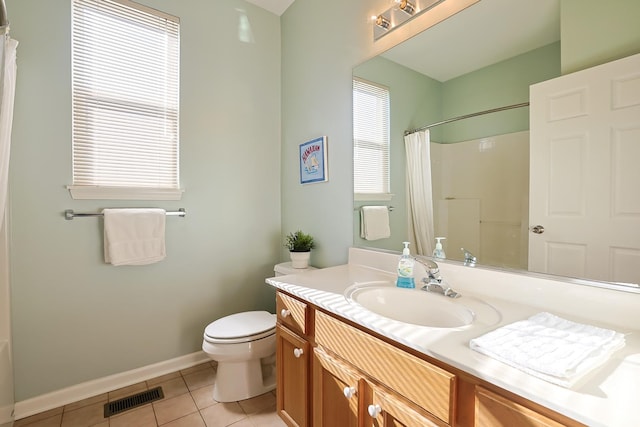 bathroom featuring a shower with curtain, vanity, tile patterned floors, and toilet