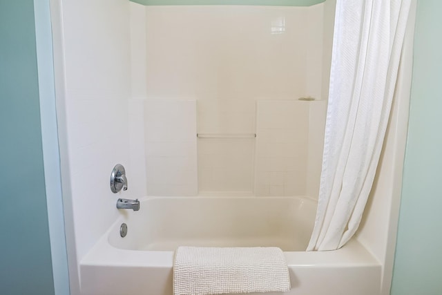 bathroom featuring shower / bathtub combination with curtain