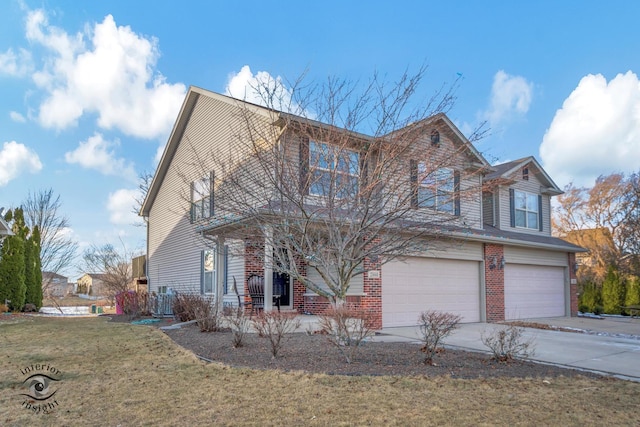 view of front of home with a garage and a front yard