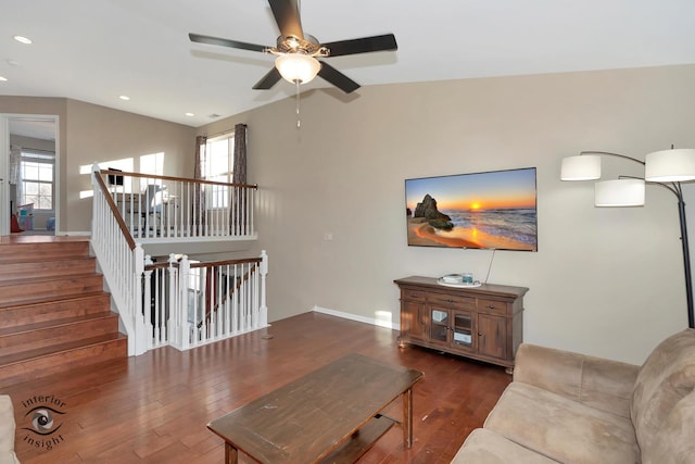 living room with dark wood-type flooring and vaulted ceiling