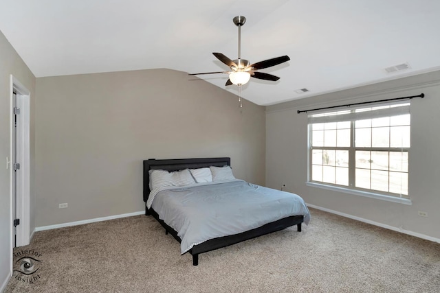 carpeted bedroom with vaulted ceiling and ceiling fan