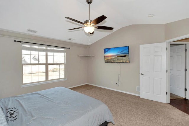 bedroom featuring lofted ceiling, carpet floors, and ceiling fan