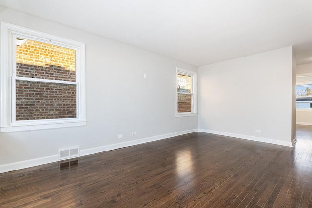 unfurnished room featuring dark hardwood / wood-style flooring