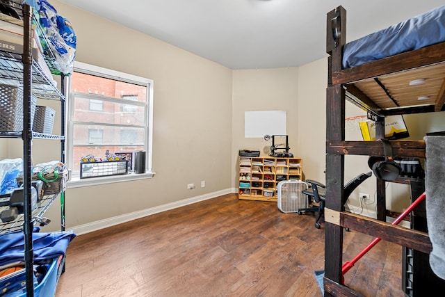 exercise area with dark hardwood / wood-style flooring