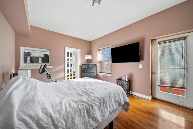 bedroom with hardwood / wood-style flooring