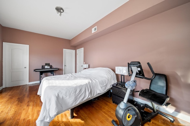 bedroom with light hardwood / wood-style floors