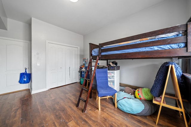 bedroom featuring dark hardwood / wood-style flooring and a closet