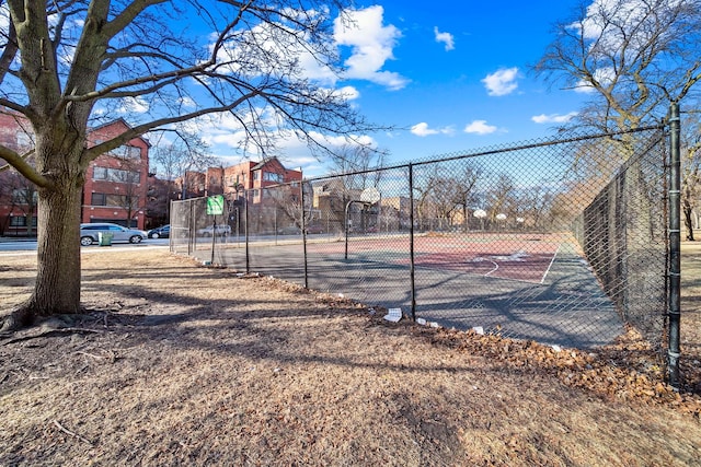 view of tennis court featuring basketball court