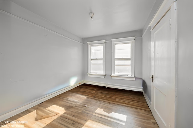 empty room featuring hardwood / wood-style flooring