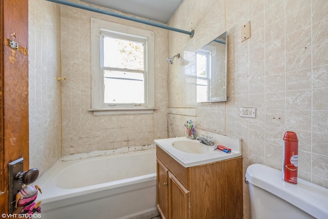 full bathroom featuring vanity, bathtub / shower combination, tile walls, and toilet