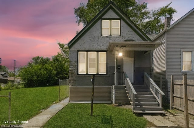 view of front of house with a lawn