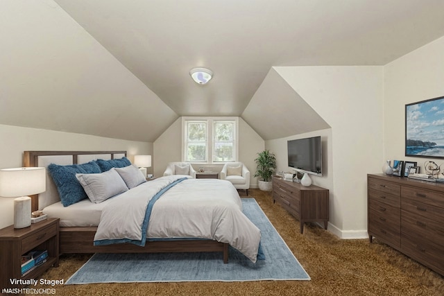 carpeted bedroom featuring lofted ceiling