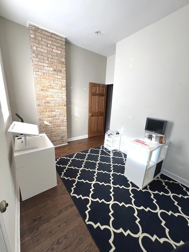 office space with dark hardwood / wood-style flooring