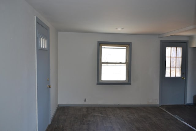 spare room featuring dark hardwood / wood-style floors