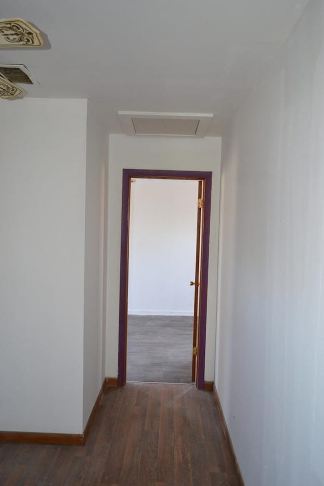 hall with dark hardwood / wood-style floors