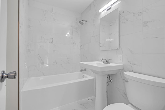 bathroom featuring tile walls, toilet, and shower / bath combination