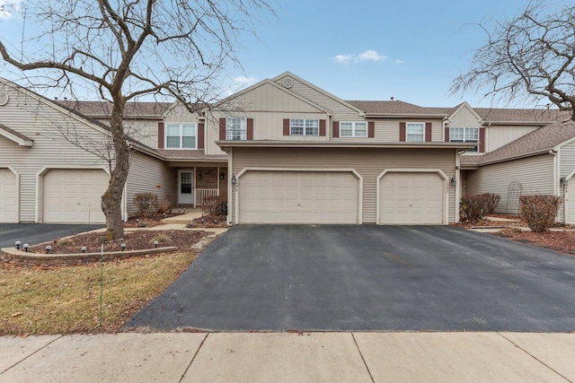 multi unit property featuring a garage