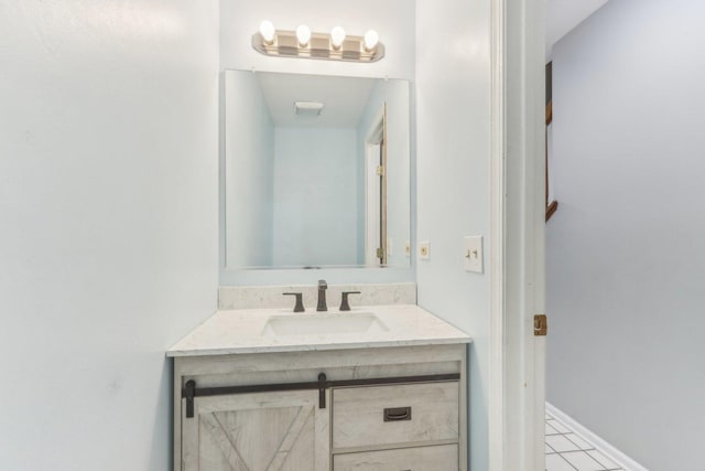 bathroom with vanity and tile patterned floors