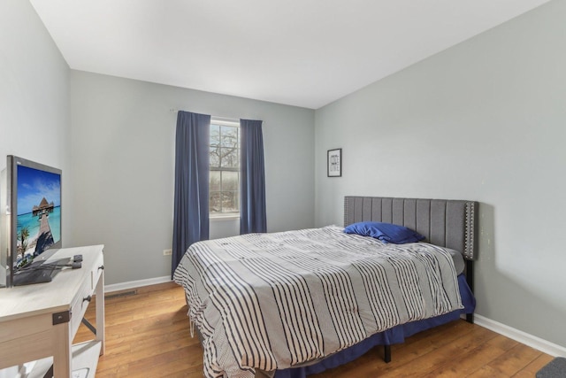 bedroom featuring hardwood / wood-style flooring