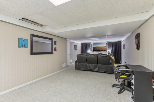 carpeted bedroom featuring a paneled ceiling