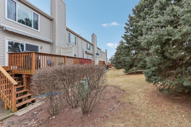 view of yard with a wooden deck