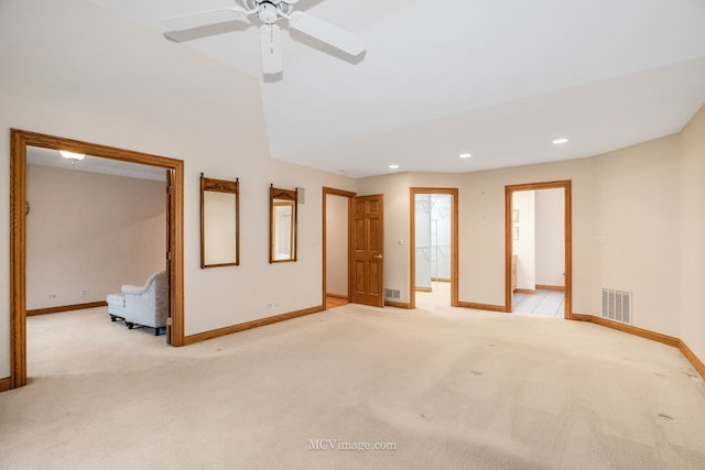 carpeted empty room with lofted ceiling and ceiling fan